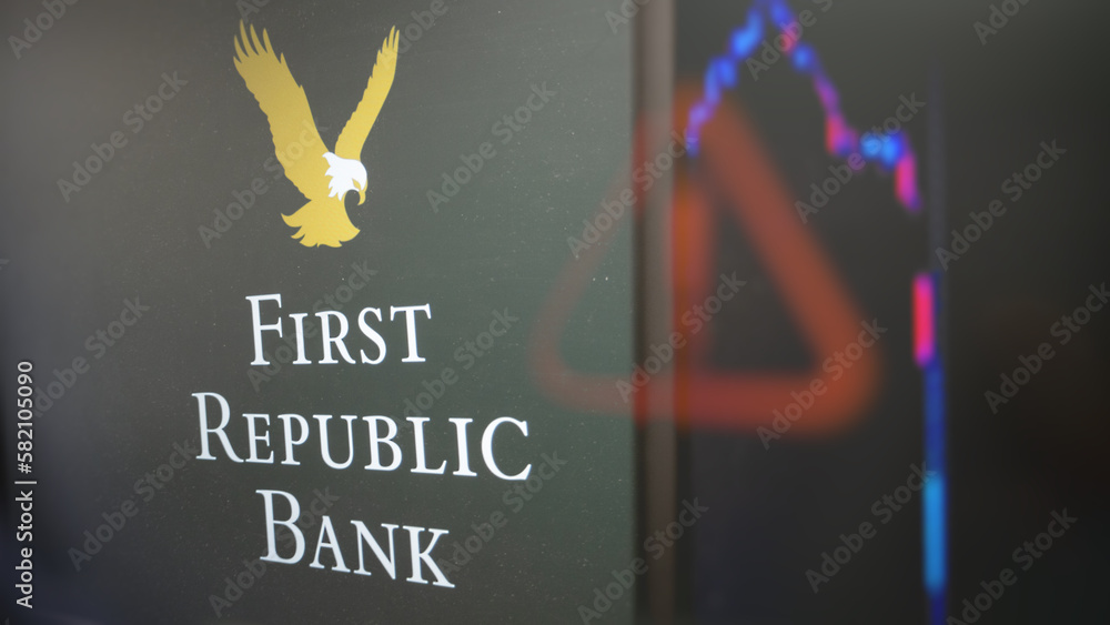 The First Republic Bank logo through a glass, with a blur alert sign