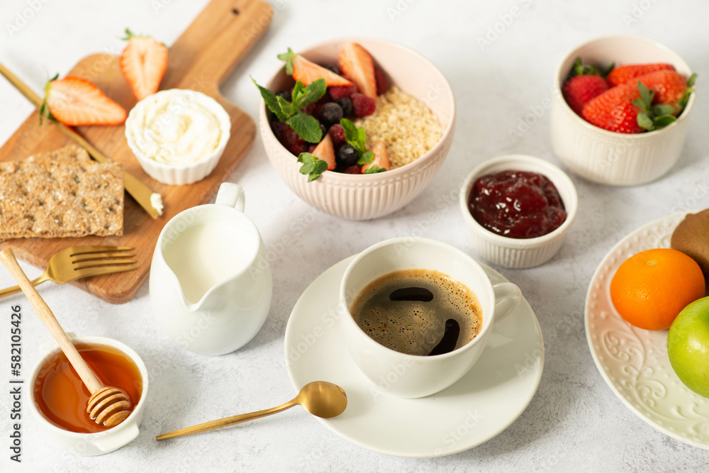 Healthy breakfast set on grey background. The concept of delicious and healthy food. Healthy breakfast set on grey background. The concept of delicious and healthy food.