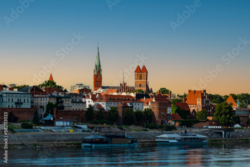 04-07-2022: View of Old City of Torun. Vistula (Wisla) river against the backdrop of the historical buildings of the medieval city of Torun. Poland.