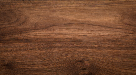 Walnut wood texture background. Wide format black walnut natural texture desktop background.