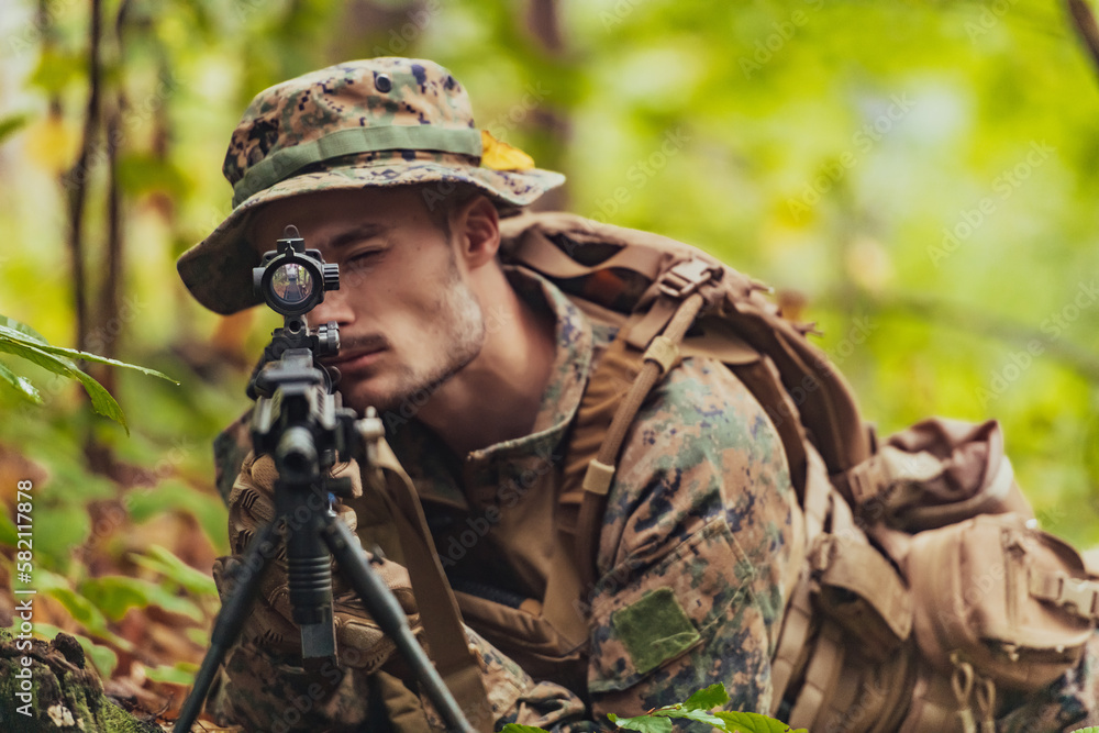 A modern warfare soldier on war duty in dense and dangerous forest areas. Dangerous military rescue operations A modern warfare soldier on war duty in dense and dangerous forest areas. Dangerous military rescue operations