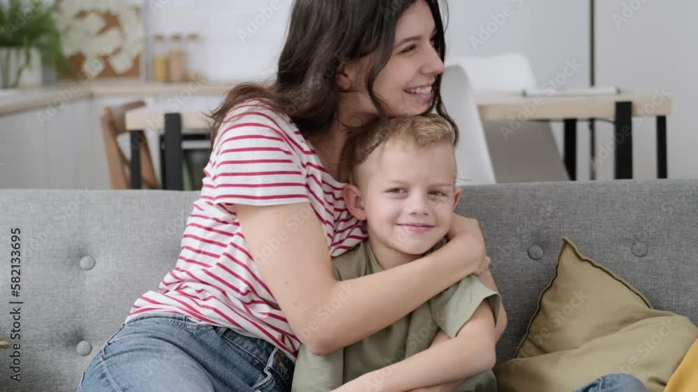 Close up portrait happy family of two making hands heart gesture, on smiling young mother bonding little cute son, overjoyed small boy showing love sign with millennial mommy at home