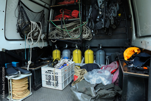 Rescue divers mobile post with a diving equipment set: balloons, wetsuits, buoys, bags photo