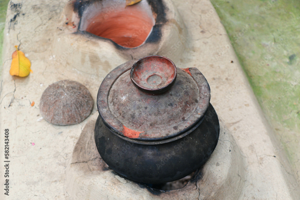 Cooking the Ancient Clay Stove in the Village Cooking the Ancient Clay Stove in the Village