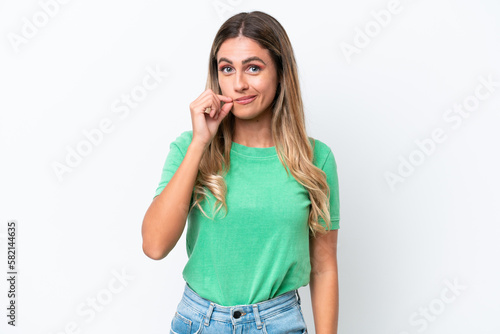 Young Uruguayan woman isolated on white background showing a sign of silence gesture
