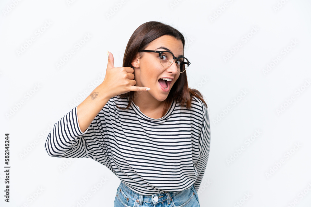 Young caucasian woman isolated on white background making phone gesture. Call me back sign Young caucasian woman isolated on white background making phone gesture. Call me back sign