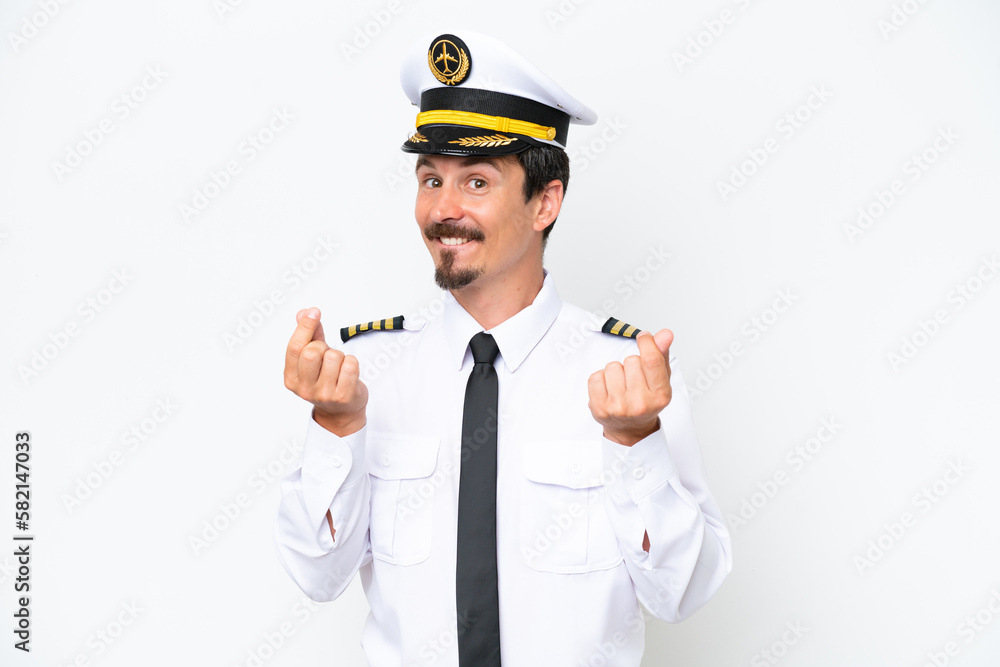 Airplane caucasian pilot isolated on white background making money gesture Airplane caucasian pilot isolated on white background making money gesture