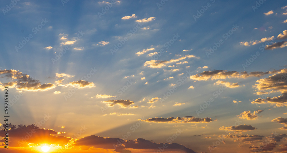 Fototapeta premium Rising Sun Shoots Out Light Rays Into The Clouds 