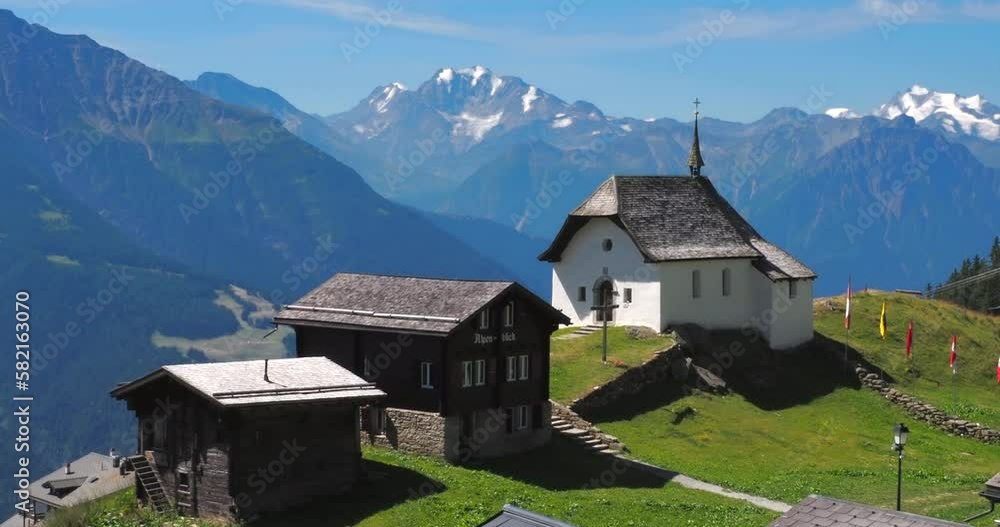 Bettmeralp, Switzerland - July 16, 2022: A church and a village of Bettmeralp, located above the Rhone Valley in Upper Valais in Switzerland Bettmeralp, Switzerland - July 16, 2022: A church and a village of Bettmeralp, located above the Rhone Valley in Upper Valais in Switzerland
