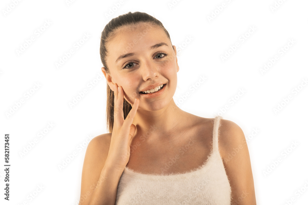 Lovely girl smiling and touching her cheek while posing on white background. Clean face, clean body skin. Beauty concept Lovely girl smiling and touching her cheek while posing on white background. Clean face, clean body skin. Beauty concept