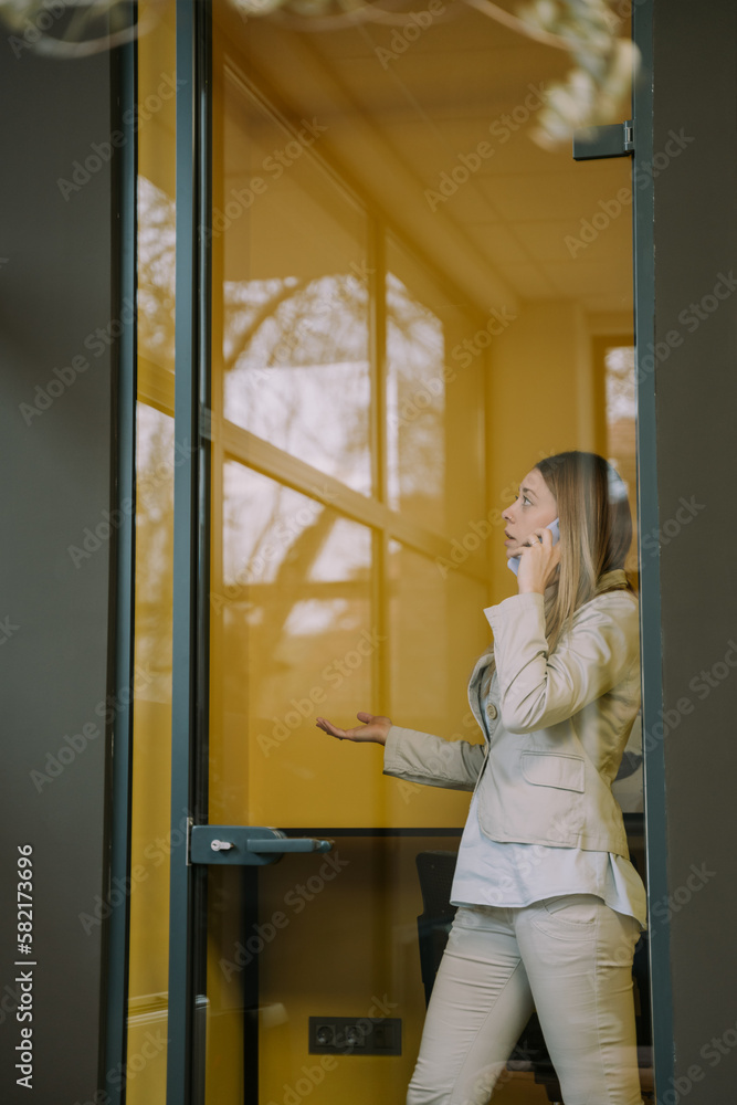 Blonde girl talking on the phone Blonde girl talking on the phone