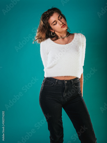 Young casual woman style portrait isolated over blue background