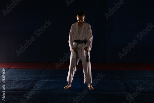Karate girl doing the Uchi Hachiji Dachi pose