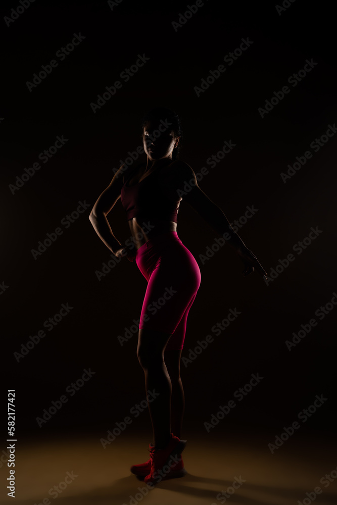 Fototapeta premium Strong woman posing in studio