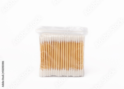 Cotton buds isolated on white background.Eco-friendly materials. Wooden, cotton swabs on a white background.Bamboo swabs. photo