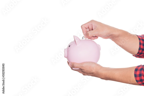 Man holding pink piggy bank and put coins in piggy bank isolated on white background with clipping path.