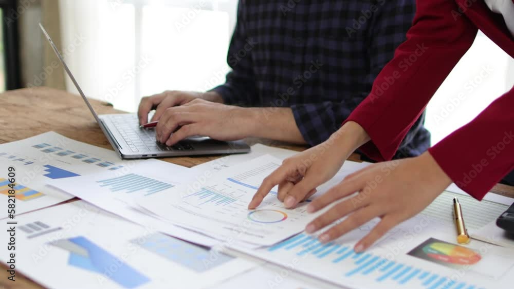 Business colleague meeting to discuss analyzing sales chart in company financial report. Meeting to discuss investment planning analysis of startup companies. Business colleague meeting to discuss analyzing sales chart in company financial report. Meeting to discuss investment planning analysis of startup companies.