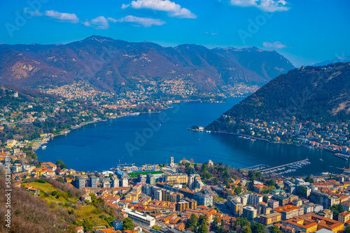 The city of Como, the lake, the lakeside promenade, the buildings, photographed from above. 