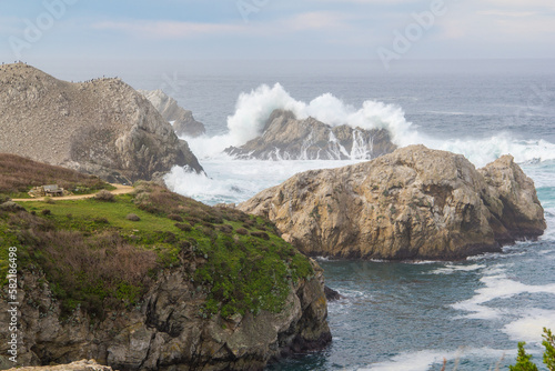 Big waves crashing on the rocky california coast near monterey california.