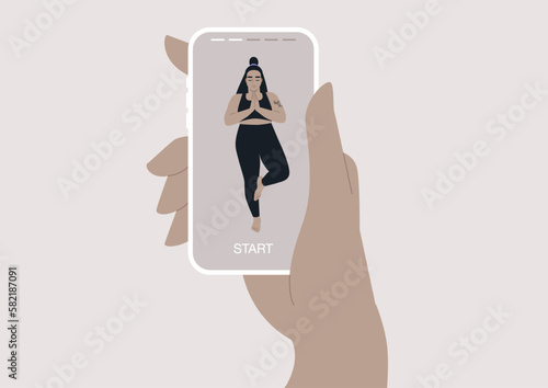 A person using a mobile phone to access a yoga vinyasa mobile app, the interface shows various options for practices, including guided meditation, breathing exercises, and other activities