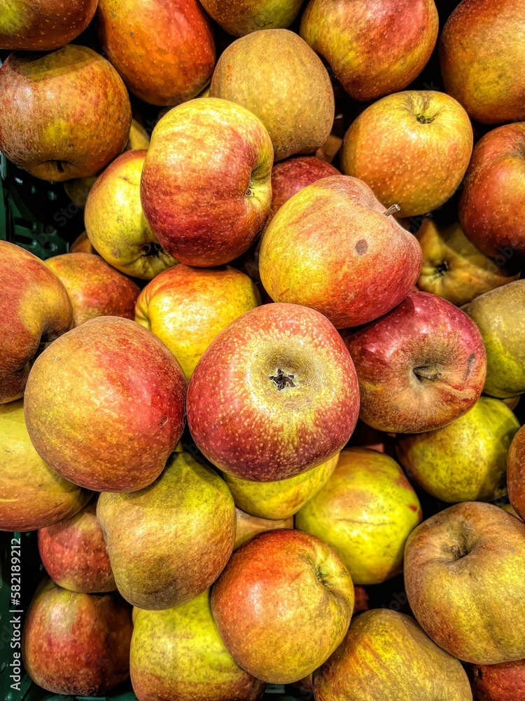 Closeup of a heap of colorful tasty apples Closeup of a heap of colorful tasty apples