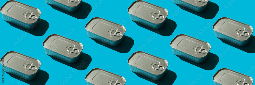 Banner with a pattern with a closed tin can on a blue background with hard shadows, the concept of canned fish at sea or in the ocean Banner with a pattern with a closed tin can on a blue background with hard shadows, the concept of canned fish at sea or in the ocean