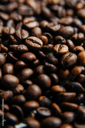 Background texture of roasted coffee beans. Arabic roasted coffee - rich taste.