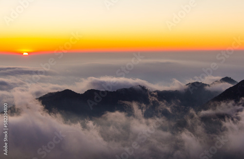 Watching the sunset over the clouds, looking over the city of Los Angeles. Views from Angeles National Forest