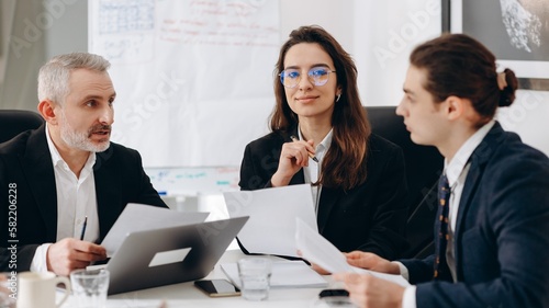 Wallpaper Mural Group of entrepreneurs discussing business contract. Business team doing paperwork in the meeting room Torontodigital.ca