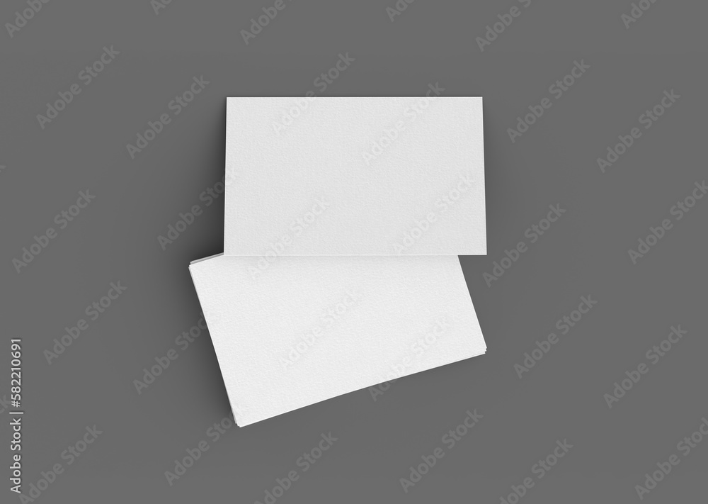Business card mockup. Stack of business cards on gray background. View directly above Business card mockup. Stack of business cards on gray background. View directly above