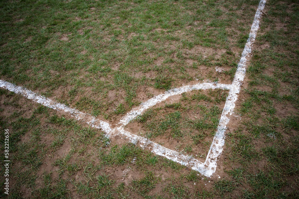 Corner markings on local muddy football pitch - obrazy, fototapety, plakaty 