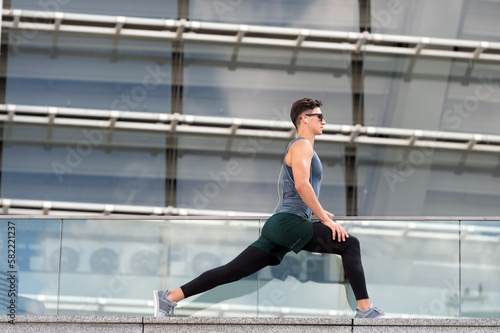 image of athlete do lunge exercise in sportswear. athlete do lunge exercise outdoor