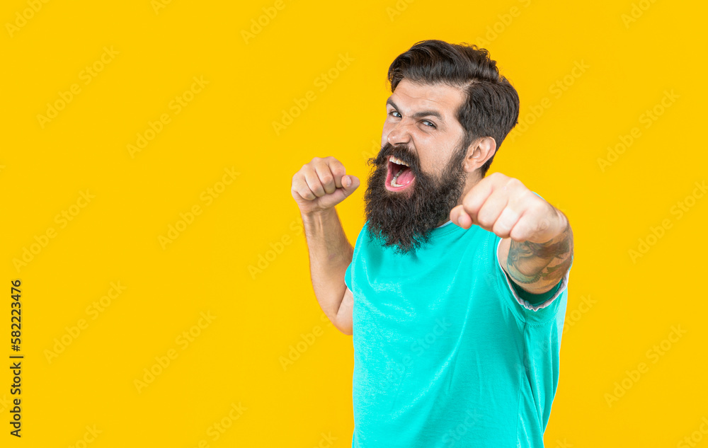 bearded man express aggression in studio with copy space. bearded man on banner advertisement bearded man express aggression in studio with copy space. bearded man on banner advertisement