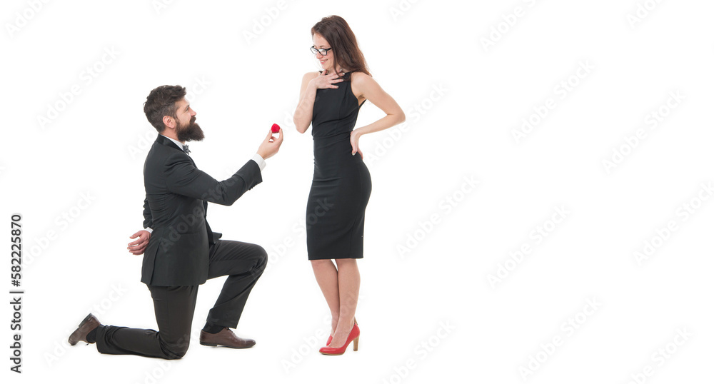 Expressing their love. man on knee making marriage proposal. Will you marry me. i said yes. happy valentines day. tuxedo couple formal event. couple in love celebrate engagement. wedding party time