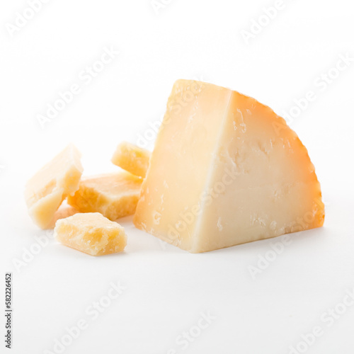 Food concept. Side view photo of slice parmesan cheese isolated on white background.
