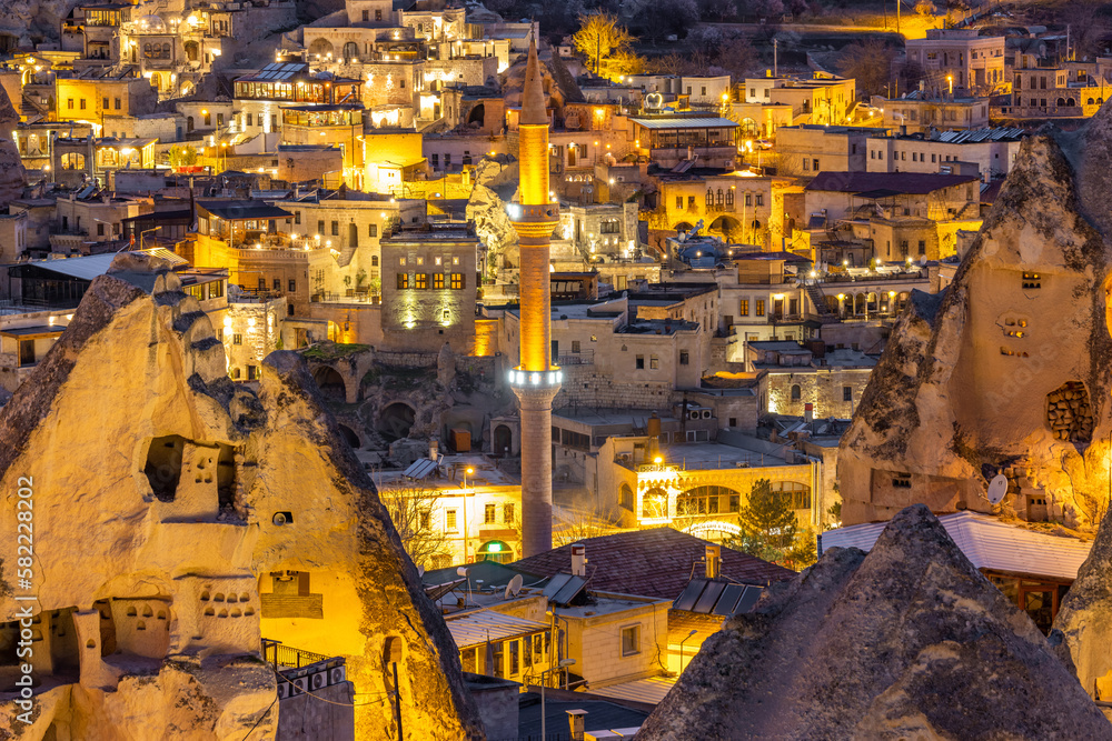 Goreme town at night, Famous tourist center of balloon fligths in Cappadocia, Turkiye, Aerial view night light Goreme City from the mountain, Night view of Goreme, Cappadocia, Turkey.