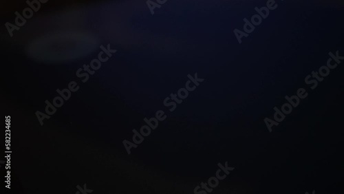 Cell phone user turns off power his smart phone. Power off smartphone. Shutting down mobile phone, closeup. Close up, macro, finger slides to side touch screen display to turning off smartphone.