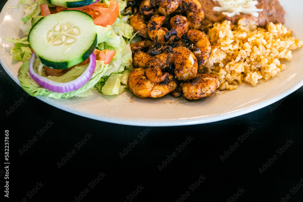 authentic mexican meal with rice, beans, shrimp and vegetables authentic mexican meal with rice, beans, shrimp and vegetables