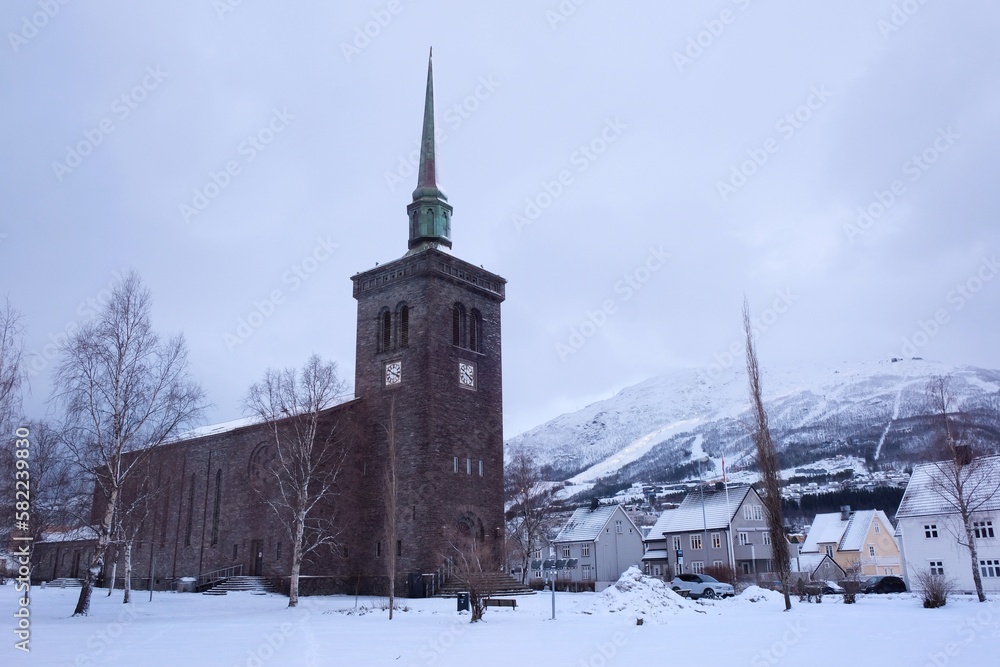 The Norwegian port city of Narvik with ancient church in winter scenery