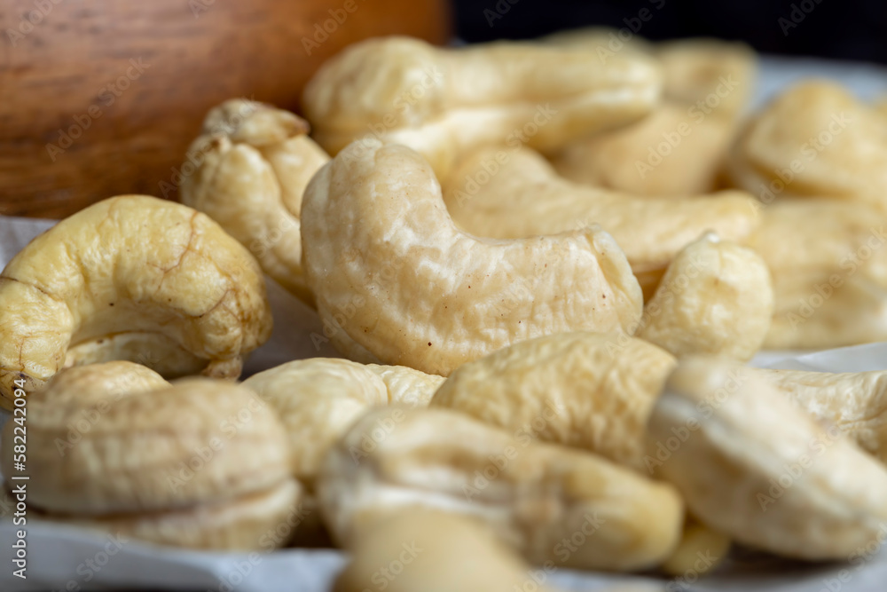 Fresh peeled cashew nuts on the table Fresh peeled cashew nuts on the table