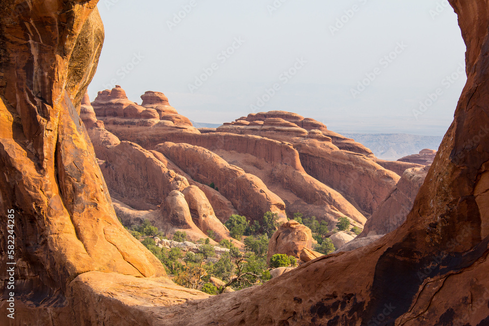 Obraz premium Views from a hike to Double-O Arch of the unique sandstone rock formations caused by erosion in Utah at Arches National Park