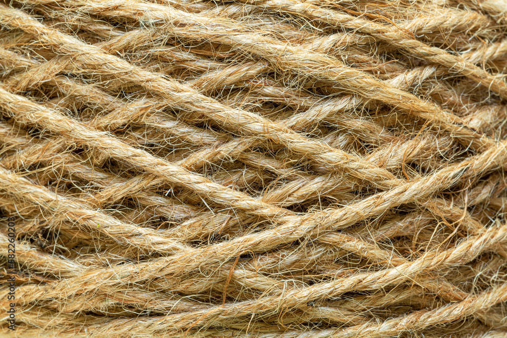 Natural made macro rope texture,Coarse rope made of natural fiber material - sisal plant. Macro photo of texture, background Natural made macro rope texture,Coarse rope made of natural fiber material - sisal plant. Macro photo of texture, background