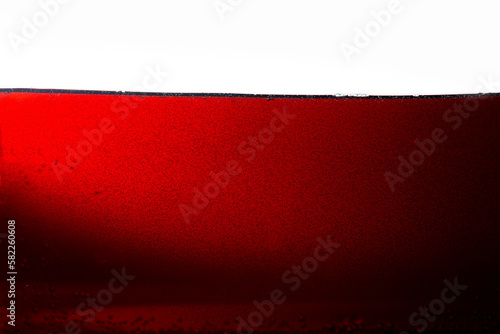 Cola texture on white background,Side view background of refreshing cola flavored soda with bubbles isolated on white