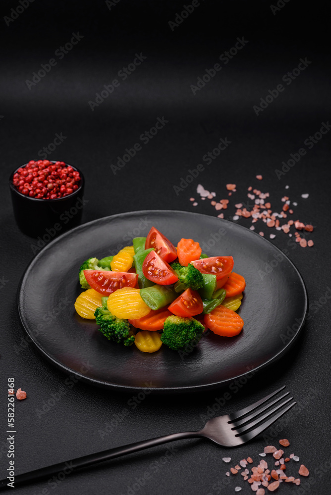 Salad of fresh and steamed vegetables cherry tomatoes, broccoli and carrots Salad of fresh and steamed vegetables cherry tomatoes, broccoli and carrots