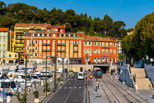 Nice port with yachts, boats and pierces in Nice Port and yacht marina district with Colline du Chateau Castle hill on French Riviera in France