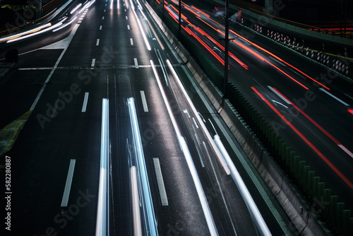 Light trails of car headlights and taillights. Driving cars captured with long exposure