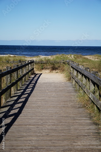 wooden pier on the beach © Flvio