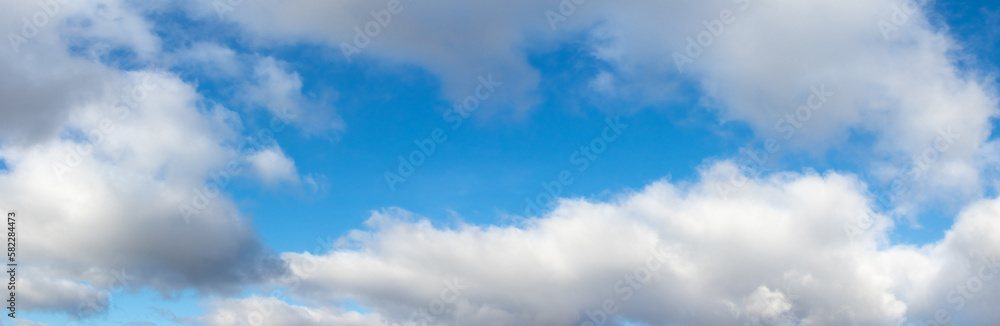 Blue sky with white curly clouds in sunny weather Blue sky with white curly clouds in sunny weather