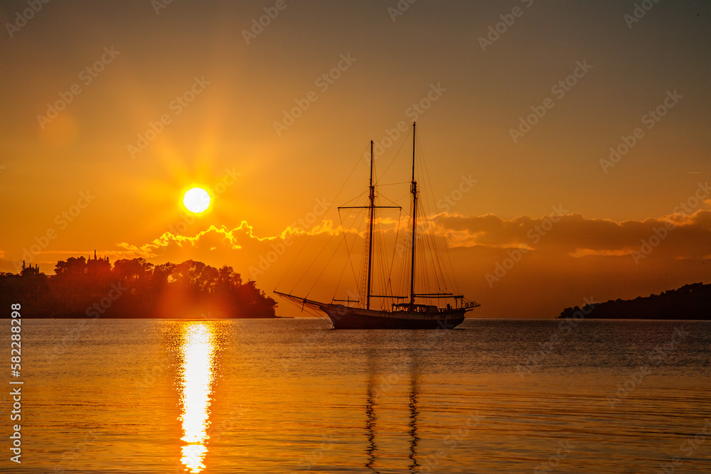 Amazing sunset over a sail boat