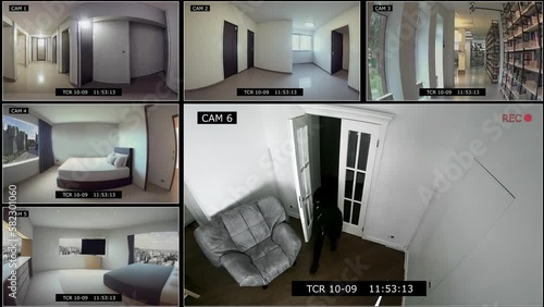 split screen video surveillance system. CCTV cameras record the entry of a burglar into the house. photo